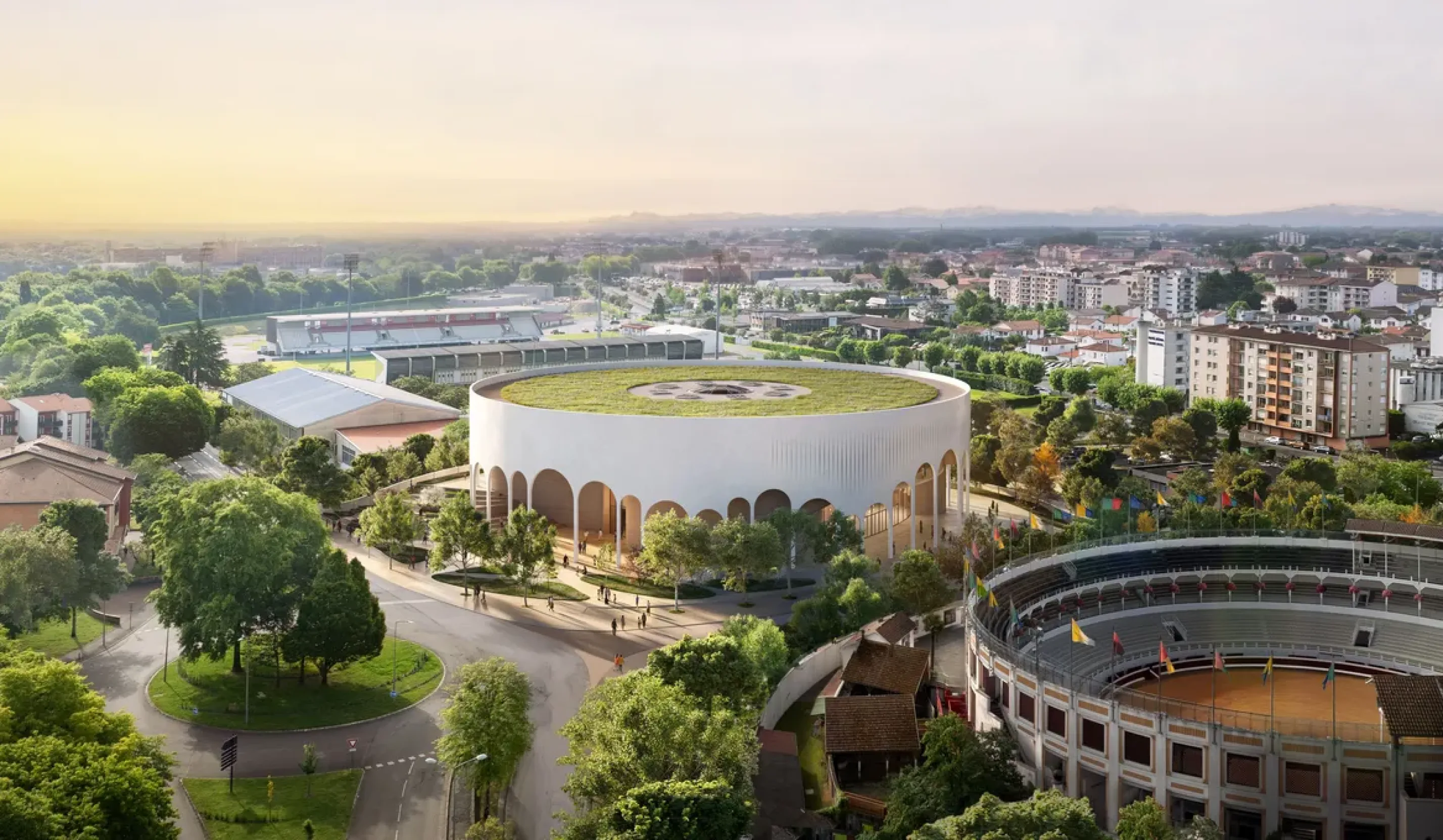 La future salle vue d'en haut, avec en premier plan les arènes et au fond le stade Maurice Boyau.